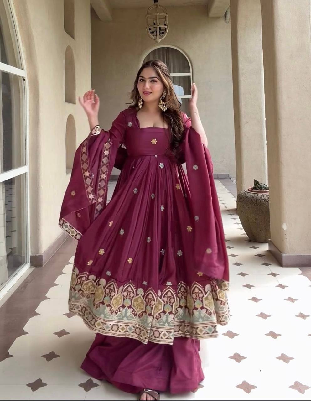 Majestic Wine Flared Anarkali Suit Set Adorned with Delicate Floral Scattered Motifs and an Ornate Heritage Embroidered Border